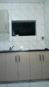 a kitchen with a sink and a window at Duplessis Lodge in Kempton Park +47 photos