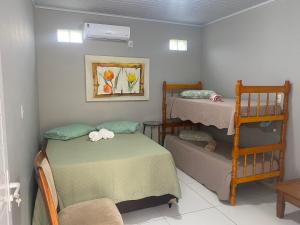 En eller flere senge i et værelse på Pousada Ferreira 415