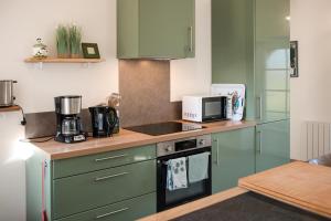 Køkken eller tekøkken på Gite de charme à la ferme - Plain-pied