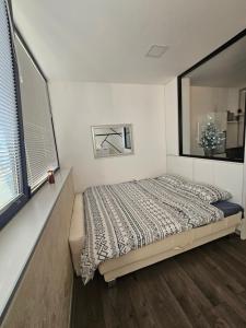 Postel nebo postele na pokoji v ubytování Ninche's Penthouse