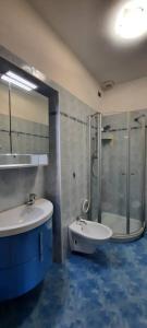 a bathroom with a tub and a sink and a shower at Appartamenti Villa Eden in Malcesine +38 photos