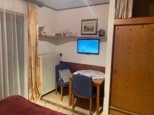 Et tv og/eller underholdning på Apartments by Haus Ingrid