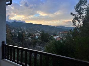 a view of a city from a balcony at ARTEMIS HOUSe in Kakopetria