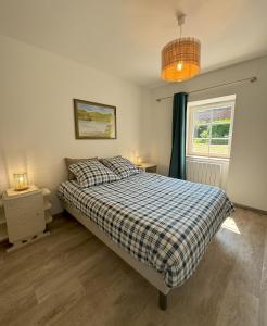 En eller flere senge i et værelse på Gîte de charme à la ferme - Duplex