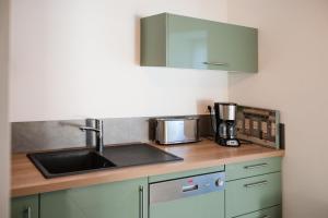 Køkken eller tekøkken på Gîte de charme à la ferme - Duplex