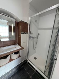a bathroom with a shower and a sink at Maison d'hôtes - La Forge de Clermont in Clermont +16 photos
