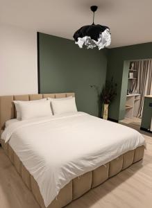 Postel nebo postele na pokoji v ubytování Sage Studio