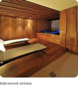 En eller flere senge i et værelse på Wellness Apartmán DAVID - Jasná VIA Demënová + 30 billeder