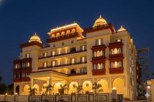a large building with domes on top of it at Hotel Ranavilas Palace in Jaipur