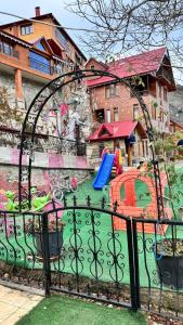a playground with a slide and a swing set at Isgobya Sumela Monastery 102 in Macka