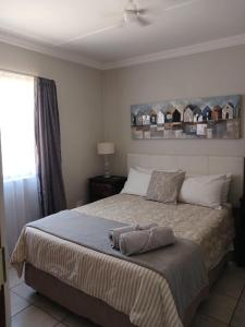 En eller flere senge i et værelse på Karoo-Hart