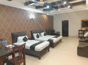 En eller flere senge i et værelse på Royal ILva Hotel