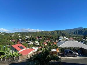 an aerial view of a town with houses and a car at Chez Sylvie et Philippe in Entre-Deux +4 photos