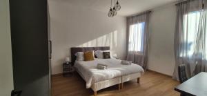 Dimora Astolfo 1-2-3 객실 침대