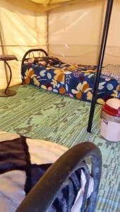 a room with a bed and a bed at Sunset Desert Camp in Al Raka +25 photos