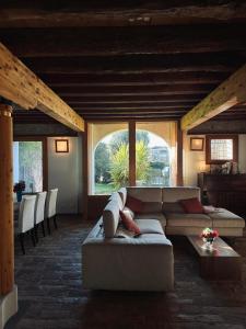 a living room with a couch and a table at La Barchessa in Corva