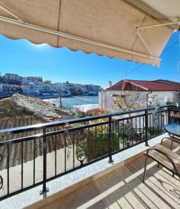 a balcony with a view of the ocean at Minos Apartments in Skala Marion