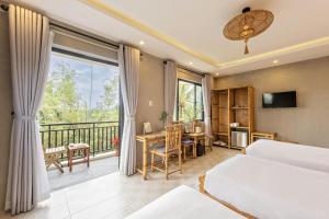 En eller flere senge i et værelse på Calm House 4 Hoi An