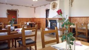A restaurant or other place to eat at Penzion Conti