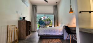 Postel nebo postele na pokoji v ubytování Casa Nahual