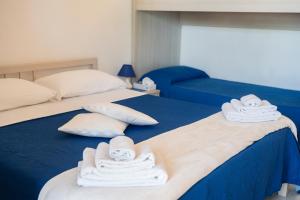 Postel nebo postele na pokoji v ubytování Pietra di Luna a...mare