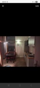 a small kitchen with a table and a dining room at Apart studio3 in Kortenberg