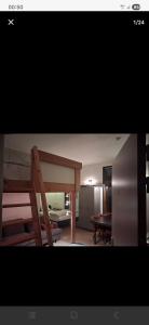 a view of a room with a bed and a living room at Apart studio3 in Kortenberg