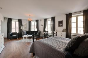 a bedroom with a bed and a living room at Haffelberg House in Riga +71 photos