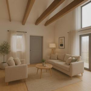 a living room with a couch and a table at Luke & House in Śliwin