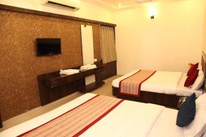 Katil atau katil-katil dalam bilik di Hotel Sai Ramanand
