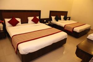 Katil atau katil-katil dalam bilik di Hotel Sai Ramanand