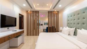 Postel nebo postele na pokoji v ubytování شقق المتألق الحديثة الفندقية