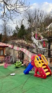 a childrens playground with a toy dog on the ground at Isgobya Sumela Monastery 106 in Macka