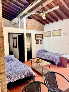 En eller flere senge i et værelse på Apartamento Colonial Puerta Azul