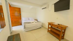 TV a/nebo společenská místnost v ubytování Pousada Cahê