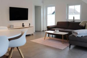 a living room with a couch and a table at Sprem06 in Elsterheide