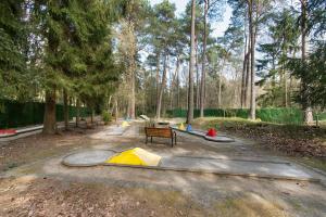 a park with a bunch of different colored tents at NEU! HeideVilla - Private Pool, Sauna & Mini Golf in Asendorf +38 photos