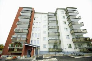 an apartment building with balconies on the side at Northern Lights Apartment in Rovaniemi