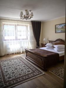 Giường trong phòng chung tại Pensiunea Casa Barsan