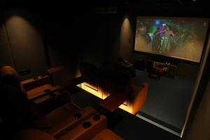 a living room with a couch and a tv at Apna Ghar in Jaipur +26 photos
