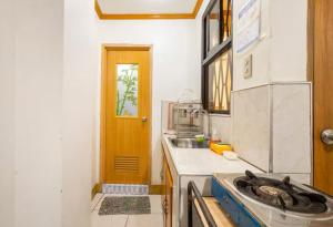 a kitchen with a sink and a counter top at CJ&K Baguio Lodge in Baguio +5 photos