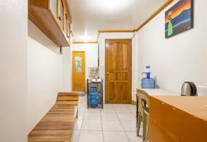 a kitchen with a counter and a stove in it at CJ&K Baguio Lodge in Baguio