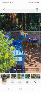 a picture of a picnic table with a swing at Casa da Rosa caminho das praias Florianópolis in Florianópolis