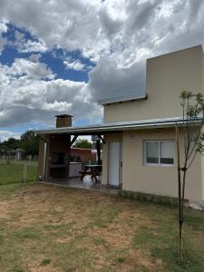 a house with a patio in front of it at Complejo Aires del Cielo in San José +14 photos