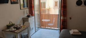 a small room with a door to a bathroom with a window at La Terrazza della Nonna in Palermo +87 photos