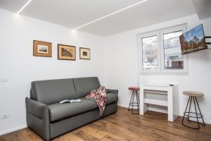 a living room with a couch and a table at Ski Gate - Main Street by Cervino View Experience in Breuil-Cervinia