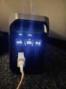 a blue box with a cable plugged into a modem at Torshaug glamping in Trondheim +31 photos