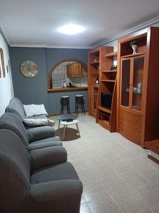 a living room with a couch and a kitchen at El Rincón del Sotillo beach in Los Alcázares +27 photos