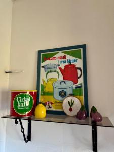 a shelf with a picture and some food on it at Holiday Home Skoaffär in Lakene