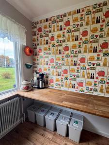 a kitchen with a counter and some trash cans at Holiday Home Skoaffär in Lakene